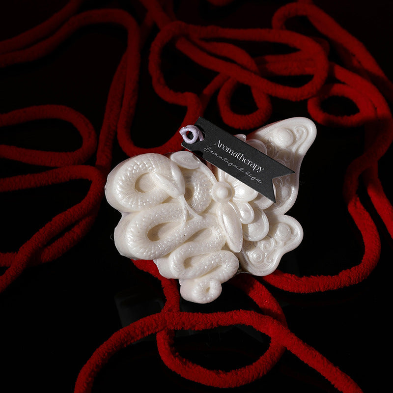 Butterfly snake low temperature candle