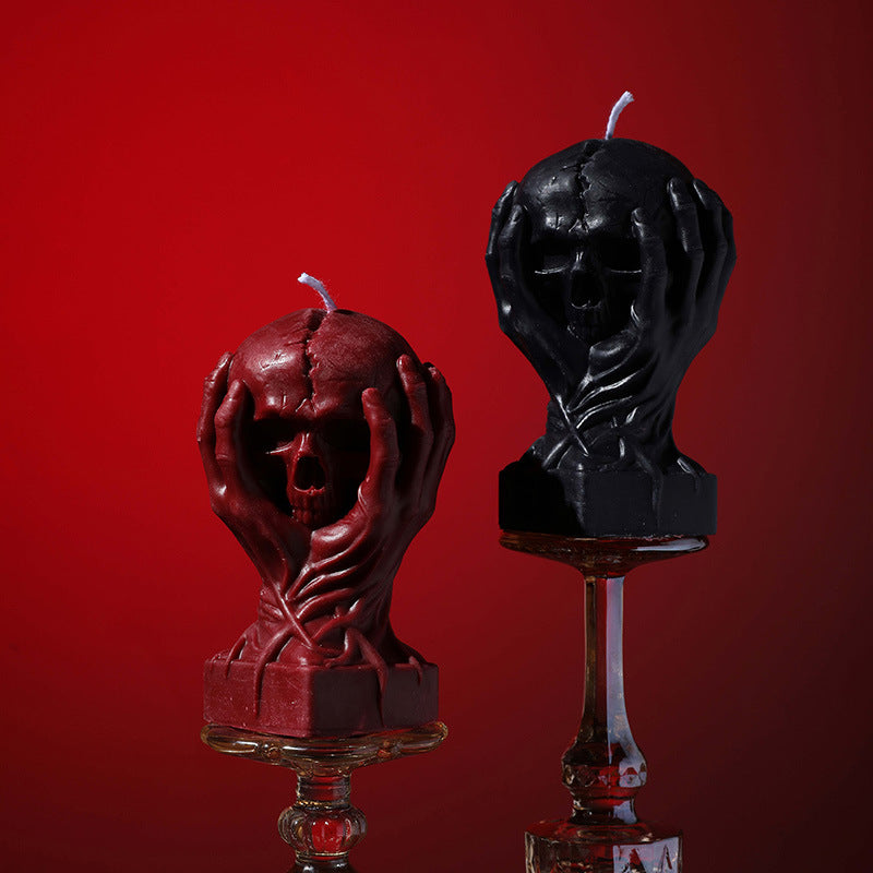Holding a skull low temperature candle