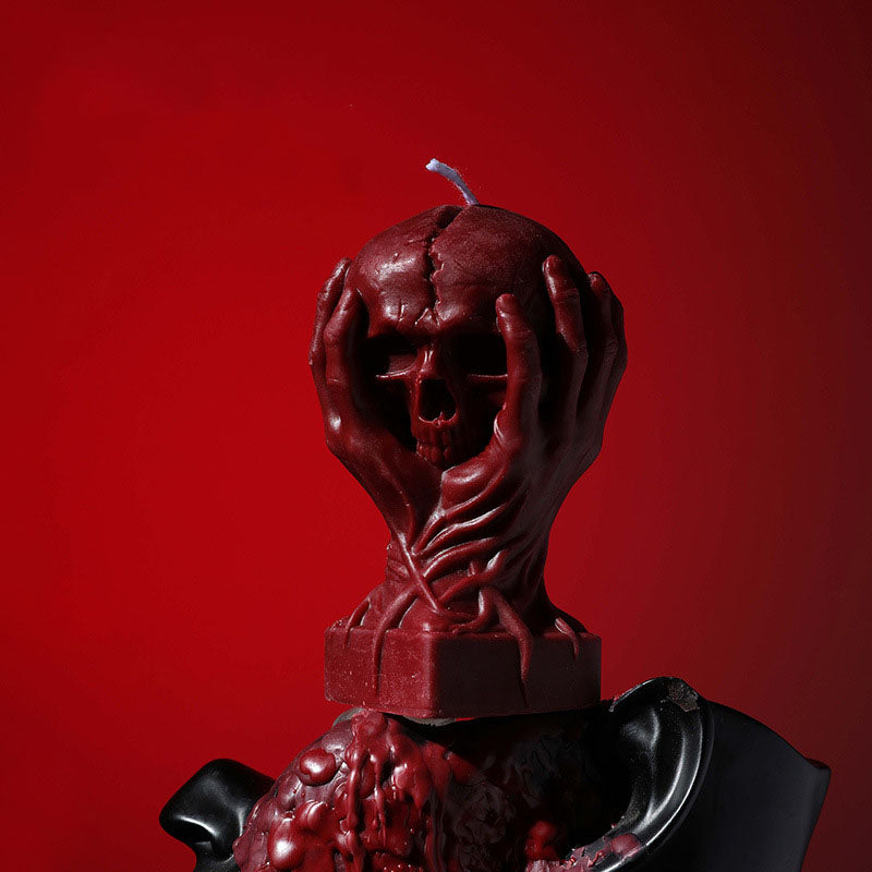 Holding a skull low temperature candle