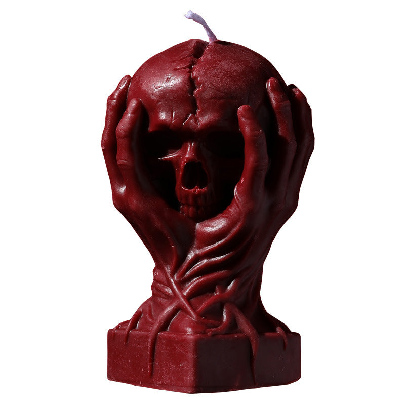 Holding a skull low temperature candle